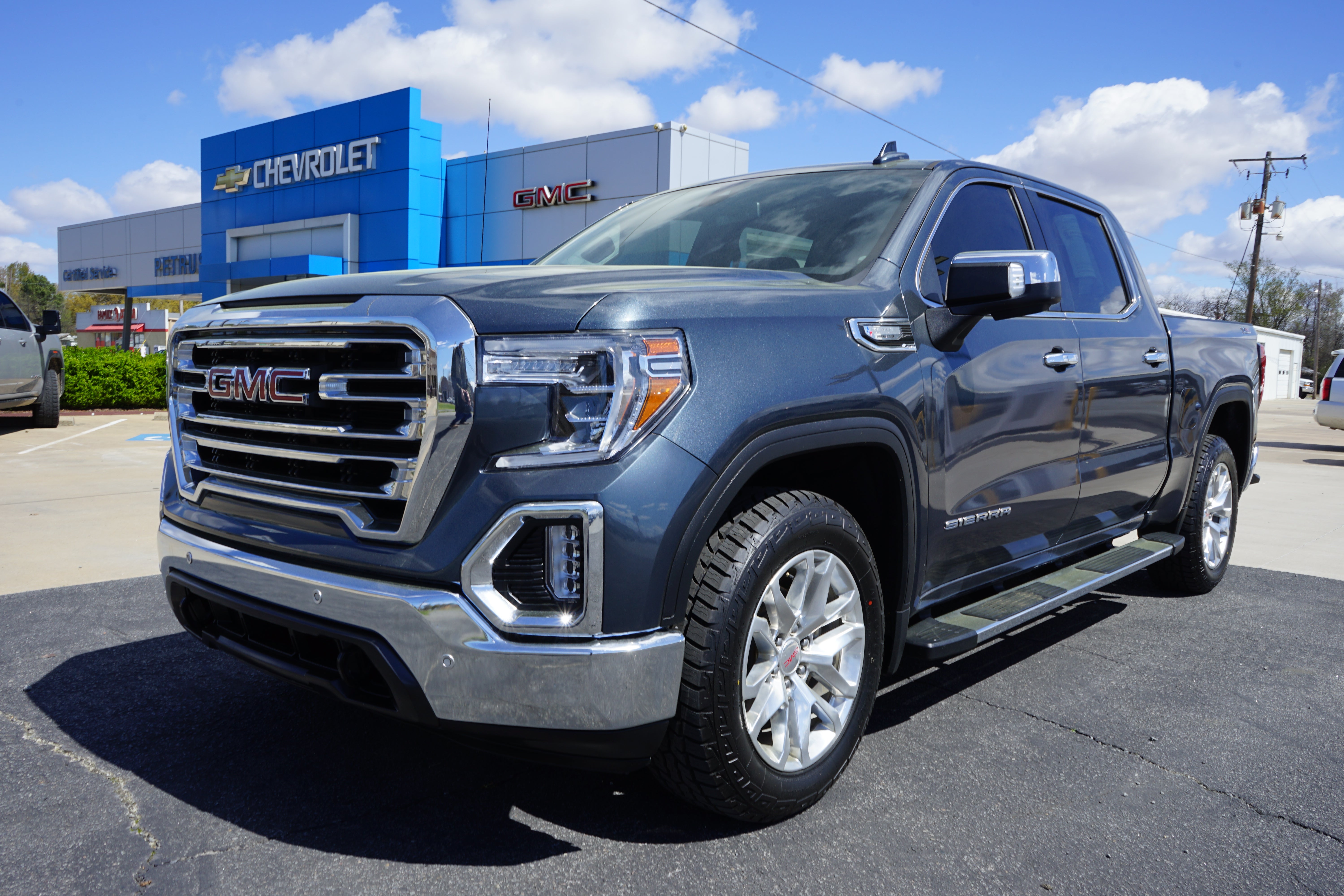 2021 GMC Sierra 1500 SLT in Dark Sky Metallic — front three-quarter view