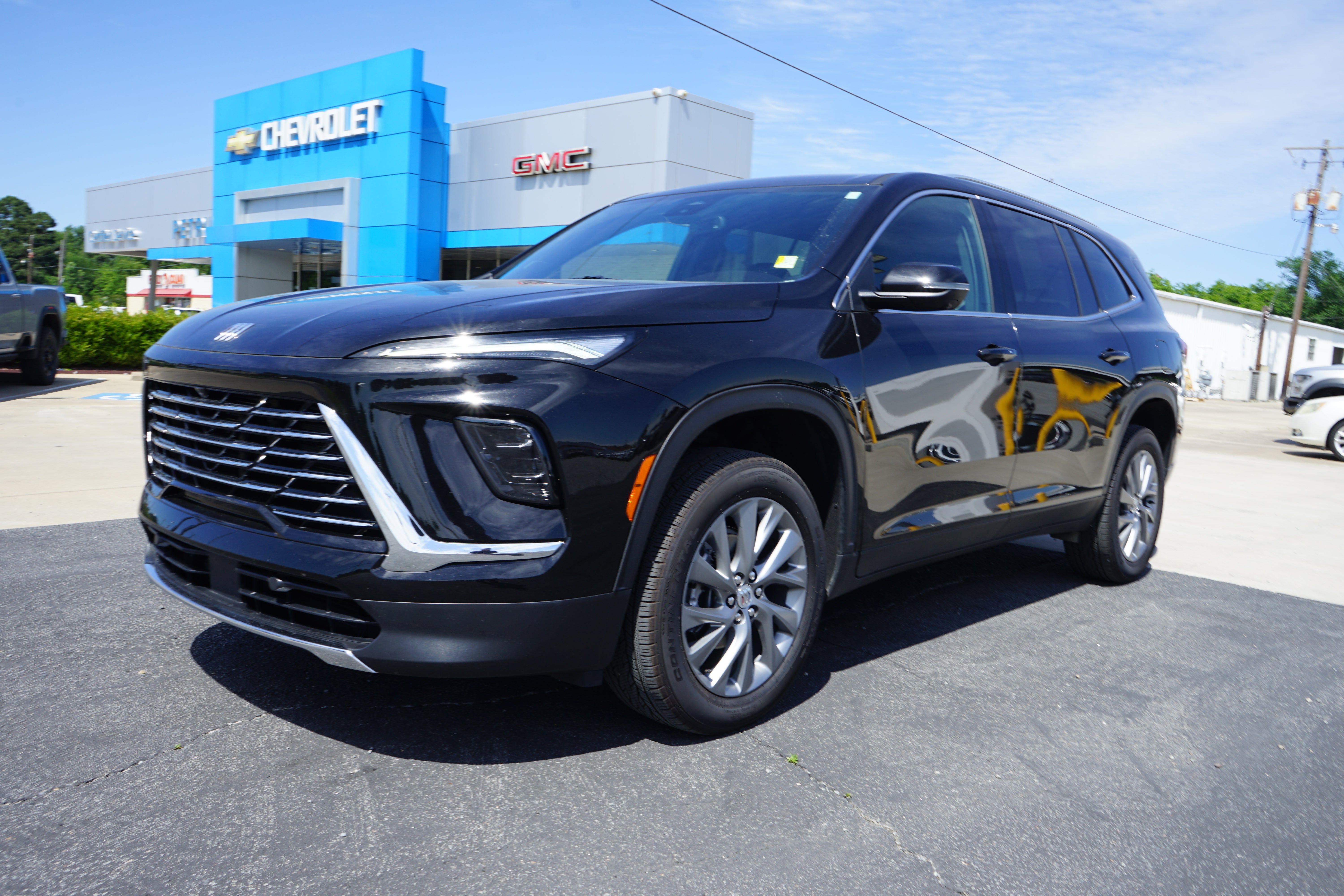 2025 Buick Enclave Preferred in Ebony Twilight Metallic — front three-quarter view